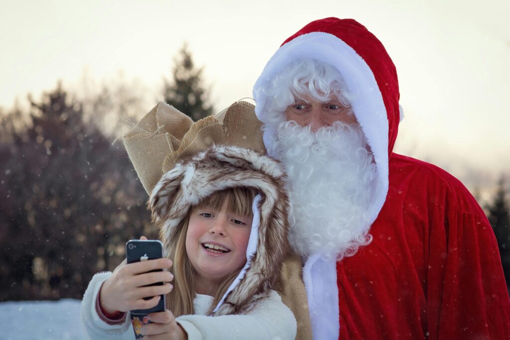 Santa and a child taking selfie